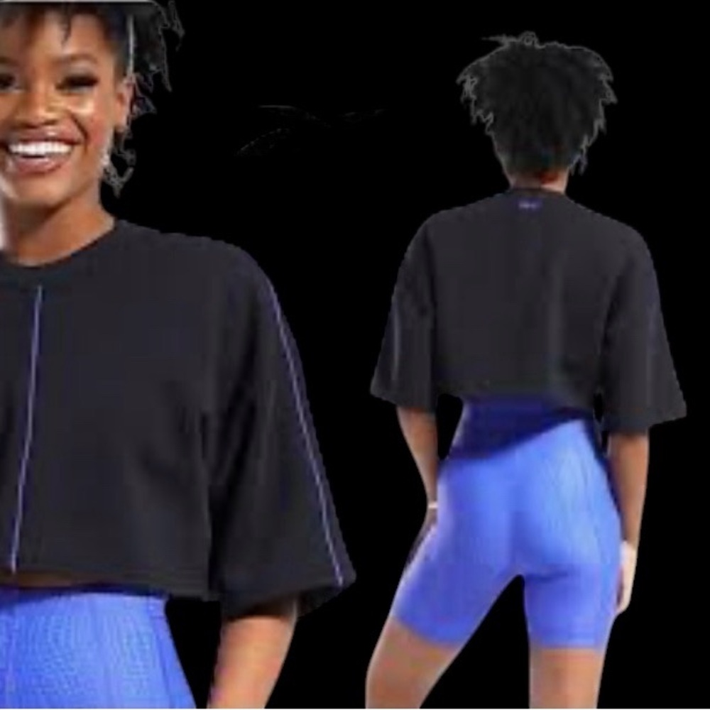 The Reebok x Cardi B Women's Crop Tee in black with purple piping